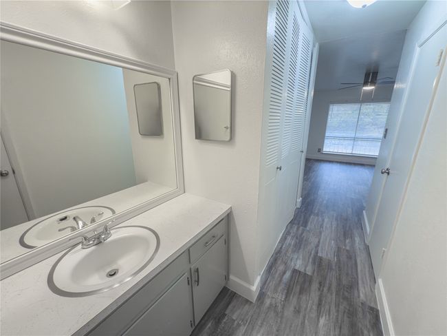 Bathroom featuring ceiling fan, vanity, and hardwood / wood-style flooring | Image 14