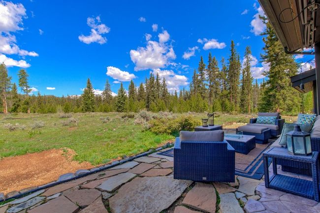 Exterior rear of the home - Step out the back door for a hike in the National Forest on extensive foot and mountain biking paths. Nothing can be built back here! | Image 44