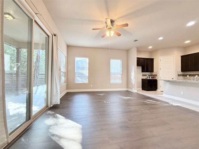 Unfurnished living room with recessed lighting, wood finished floors, and ceiling fan | Image 9