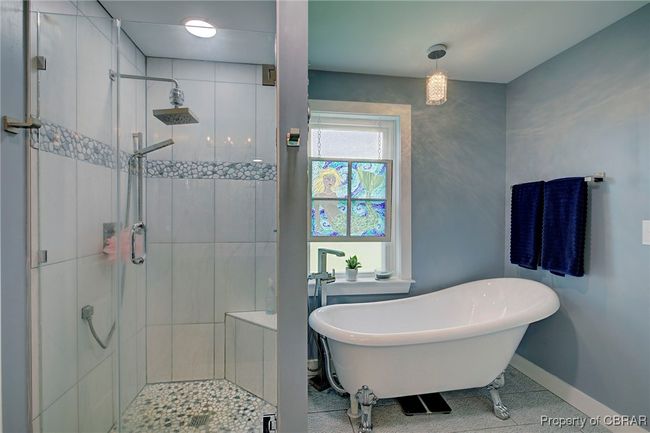 Bathroom featuring tile patterned floors and plus walk in shower | Image 44