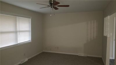 Carpeted empty room with ceiling fan | Image 3