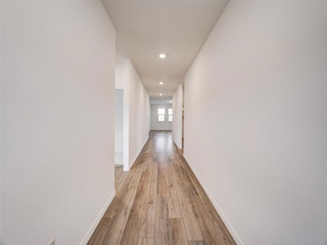 Hallway featuring light wood finished floors, recessed lighting, and baseboards | Image 16
