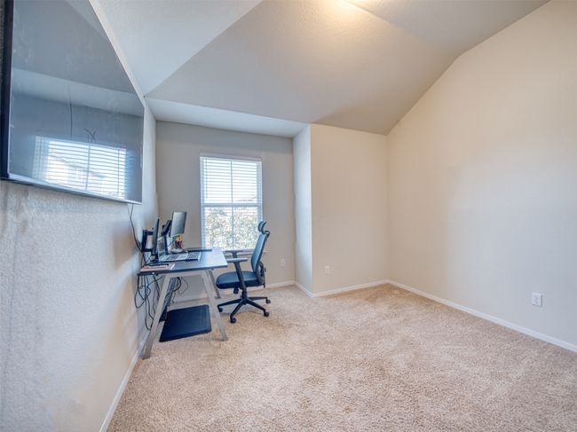 Carpeted home office with vaulted ceiling | Image 18