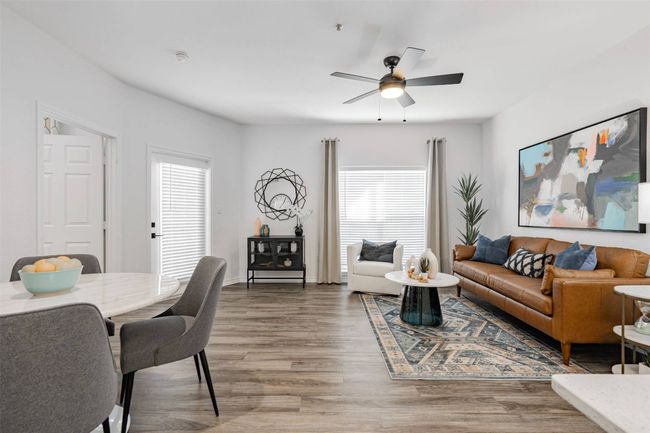 Living room with ceiling fan and hardwood / wood-style flooring | Image 9