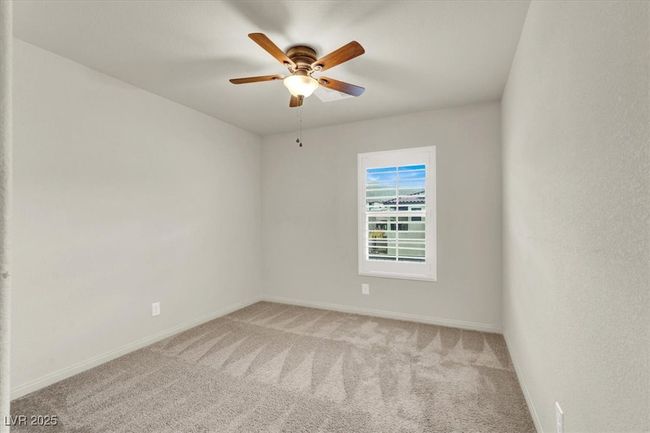 Spare room featuring light carpet and ceiling fan | Image 48