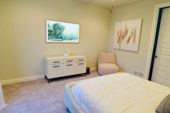 Bedroom featuring light carpet and baseboards | Image 22