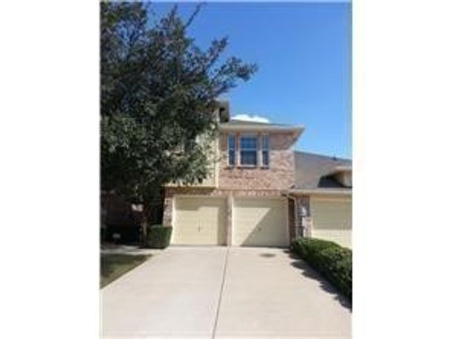 View of front facade featuring driveway and an attached garage | Image 10