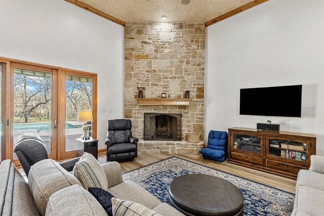 Handsome Stone Floor to Ceiling Gas Fireplace | Image 5