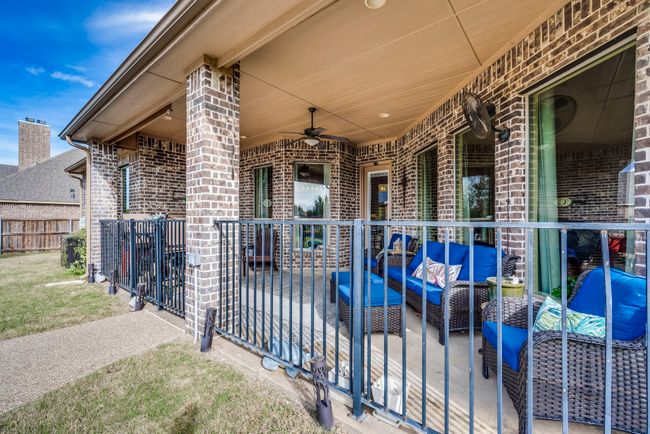View of patio featuring an outdoor hangout area and ceiling fan | Image 10