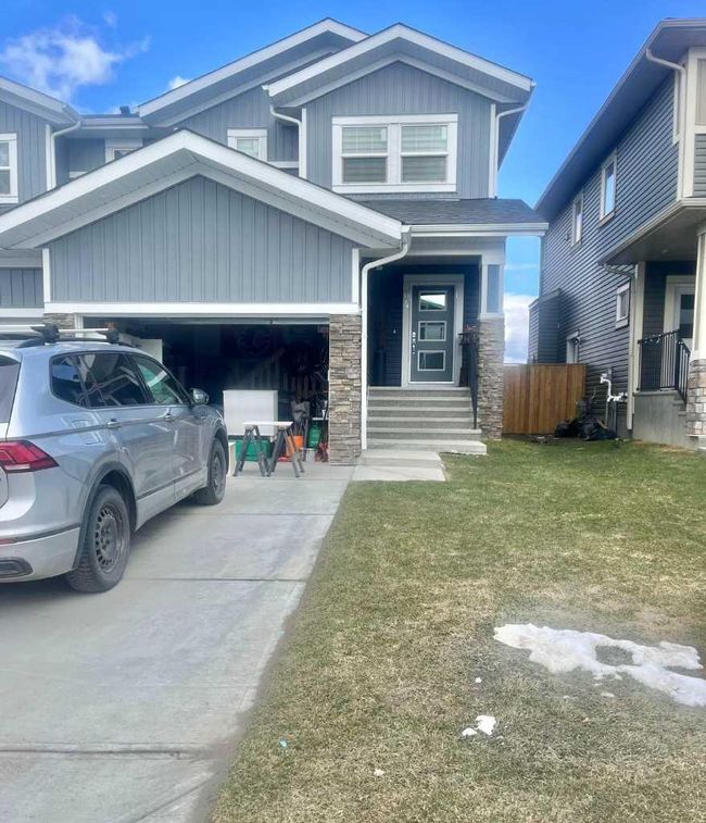 64 Midtown Close Sw, Home with 4 bedrooms, 3 bathrooms and 2 parking in Airdrie AB | Image 1