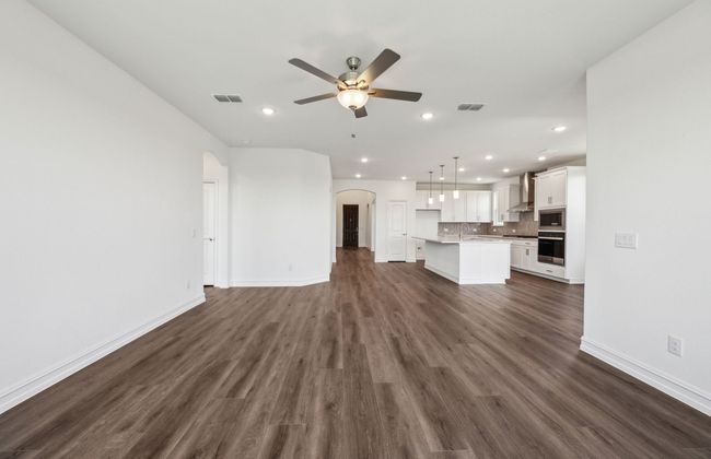 Airy gathering room showcases open concept floorplan *Real home pictured | Image 9