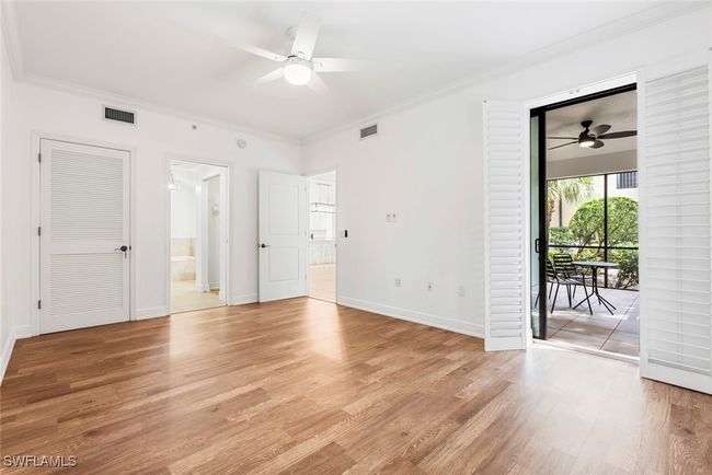 Unfurnished room with light hardwood / wood-style flooring, ornamental molding, and ceiling fan | Image 10