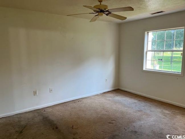Spare room with carpet floors and ceiling fan | Image 7