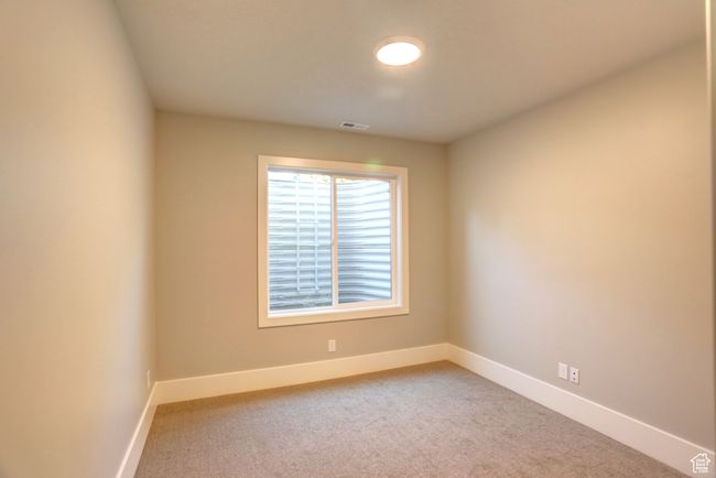 Empty room with baseboards and light colored carpet | Image 34
