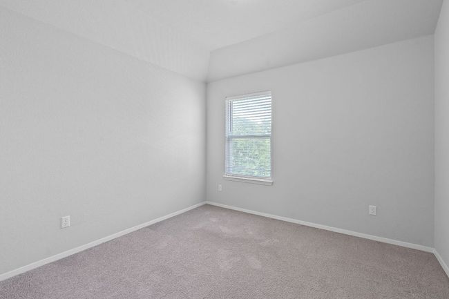 Carpeted empty room featuring baseboards | Image 25