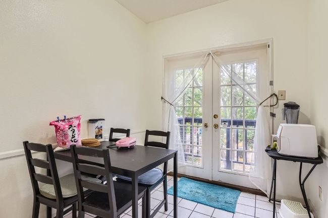 Dining room featuring light tile patterned floors and french doors | Image 10