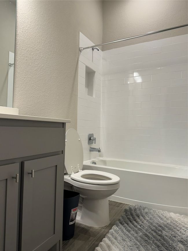 Full bathroom featuring vanity, shower / washtub combination, and toilet | Image 9