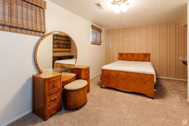 Bedroom featuring carpet flooring and a textured ceiling | Image 23