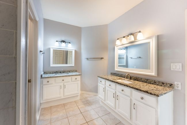 Bathroom featuring vanity and tile patterned flooring | Image 17