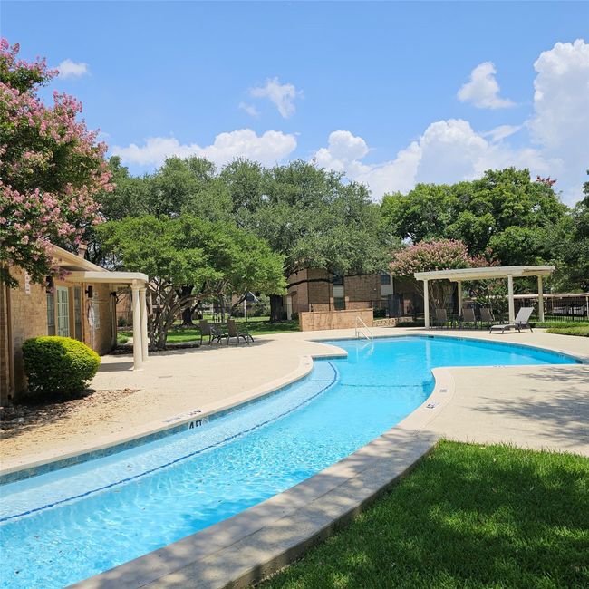 Community pool with a pergola and a patio area | Image 6