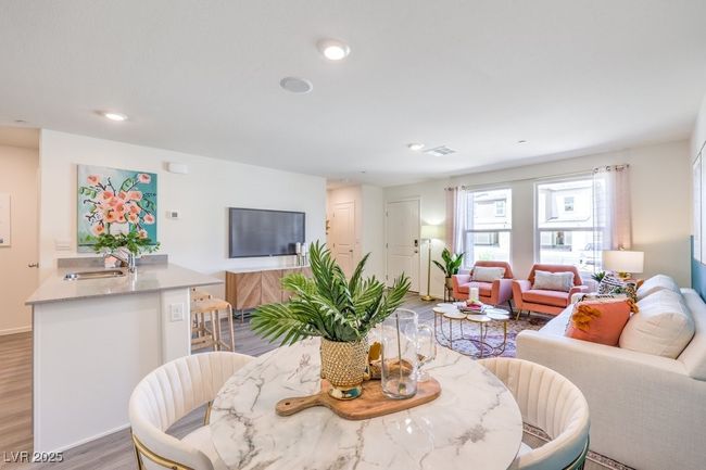 Living room with visible vents, light wood-type flooring, and recessed lighting | Image 11