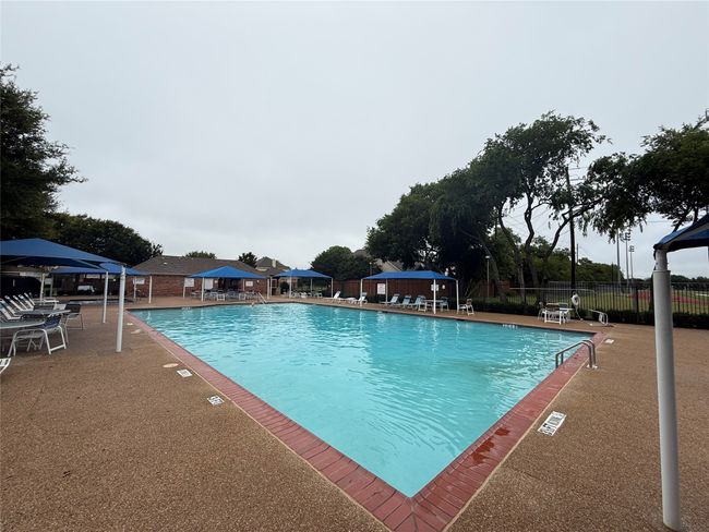 Community pool featuring a gazebo and a patio area | Image 35