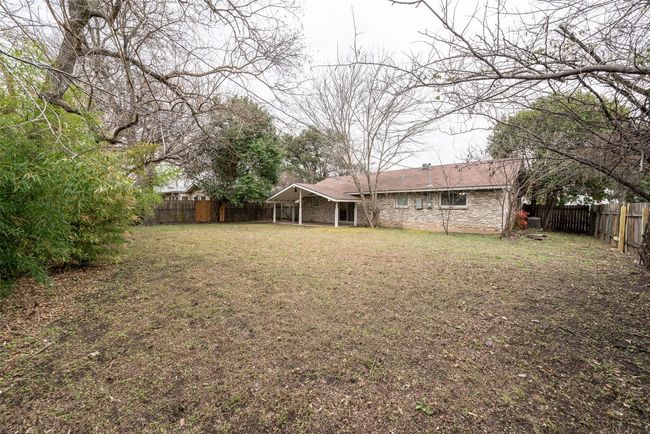 View of fenced backyard | Image 6