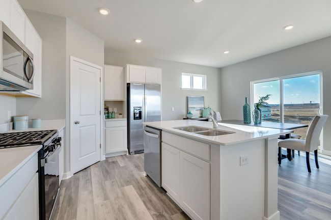 Windows in the home let in the natural light. Photo is of a previously built model home, finishes and selections will vary. | Image 5