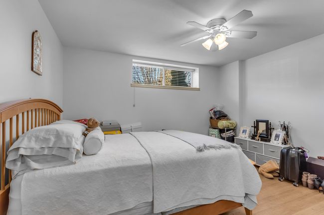 Bedroom featuring light wood-style floors and a ceiling fan | Image 27