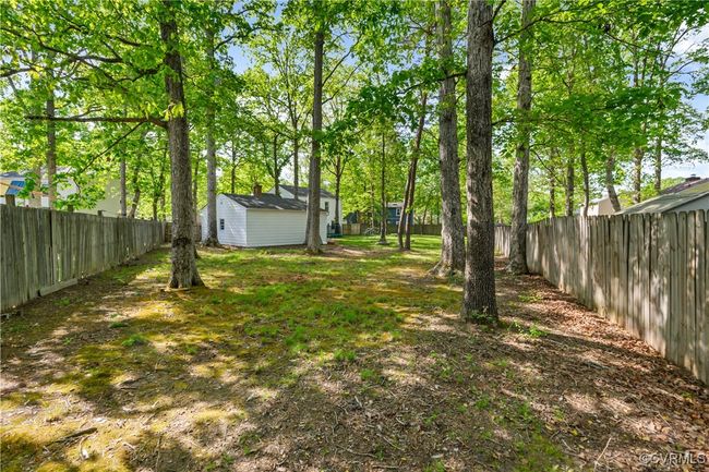 View of yard with an outbuilding and a fenced backyard | Image 23