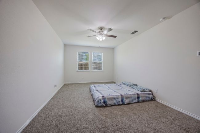 Unfurnished bedroom with carpet flooring and ceiling fan | Image 15
