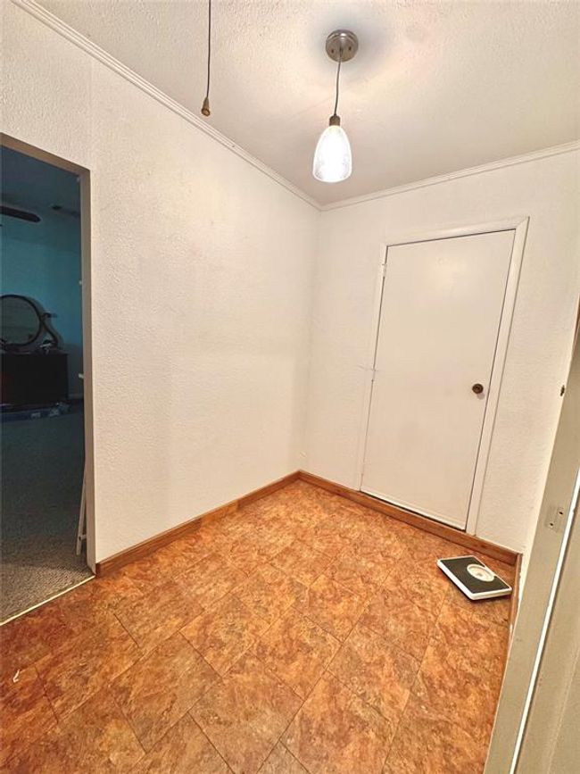Mud room with access to the back yard. | Image 11