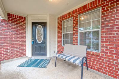 Unwind on your charming front porch. | Image 2