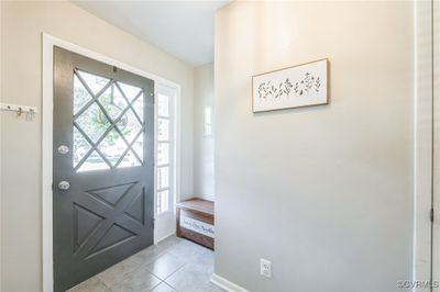 Foyer entrance with light tile patterned flooring | Image 3