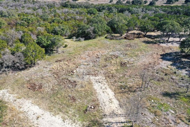 Aerial view of property and surrounding area featuring a heavily wooded area | Image 5