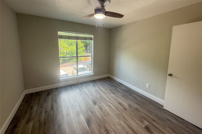 Unfurnished room featuring finished floors and ceiling fan | Image 7