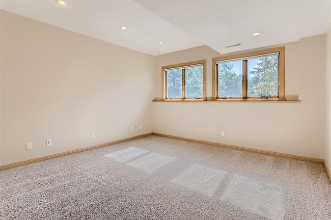 Bedroom #4 in the lower level features a walk-in closet and... | Image 24