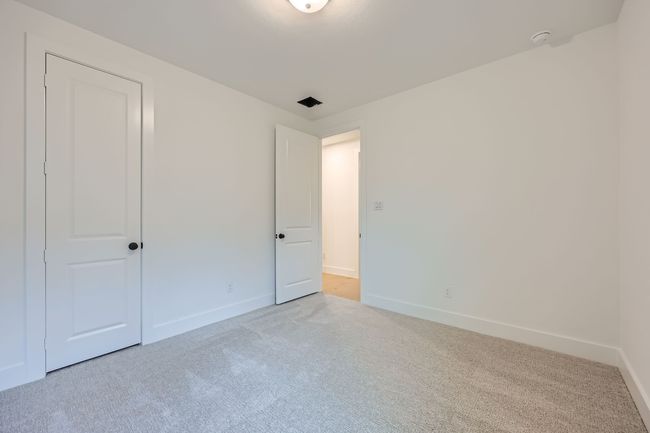 Unfurnished bedroom featuring carpet flooring and baseboards | Image 21