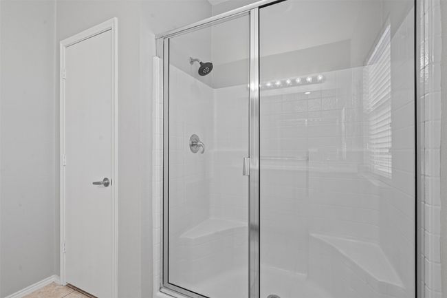 Bathroom featuring a stall shower | Image 15