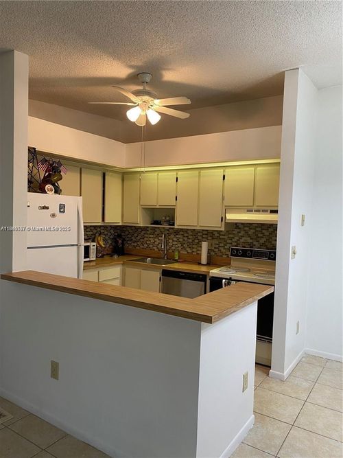 210-10407 E Clairmont Cir, Tamarac, FL, 33321-7829 | Card Image