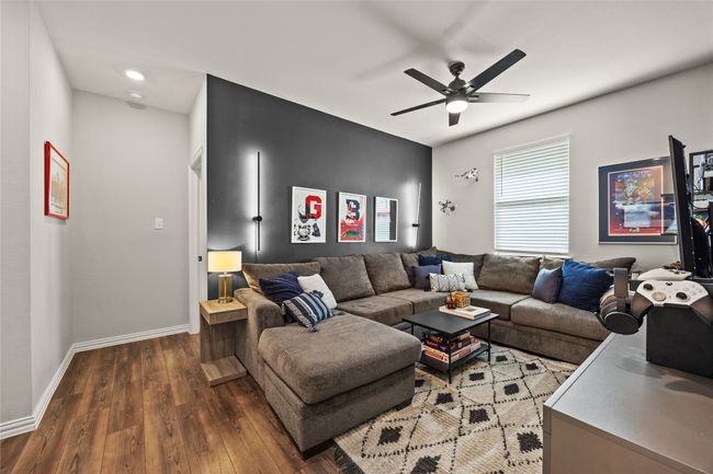 Gameroom With Ceiling Fan and Premium Vinyl Flooring. | Image 15
