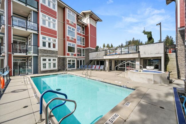 Community pool with a patio area | Image 37