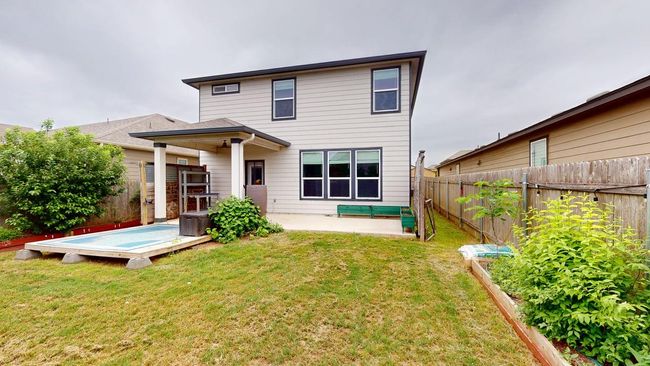 Back of property featuring a lawn, a patio, and a fenced backyard | Image 37