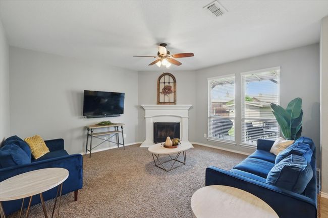 Living room featuring baseboards, a ceiling fan, and carpet floors | Image 13