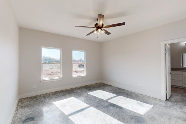 Carpeted spare room with baseboards and a ceiling fan | Image 19