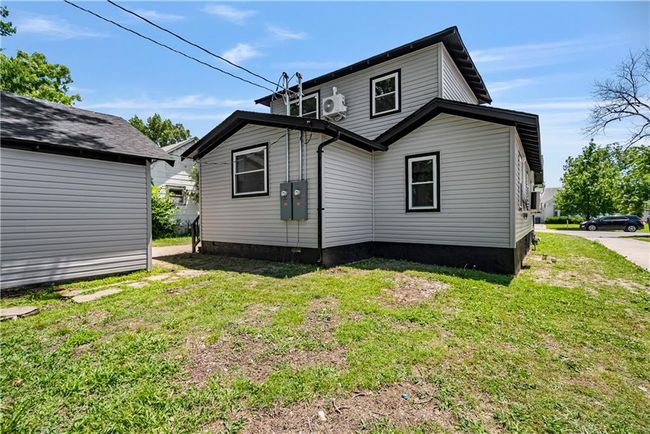Back of property featuring a yard and ac unit | Image 50