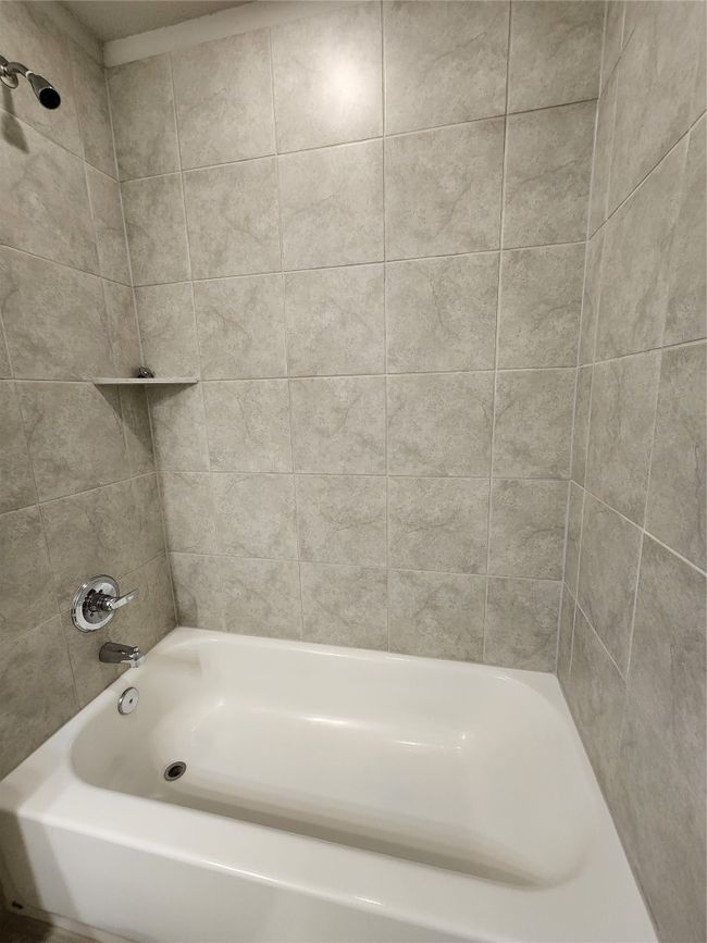 Full bathroom featuring shower / bath combination | Image 19
