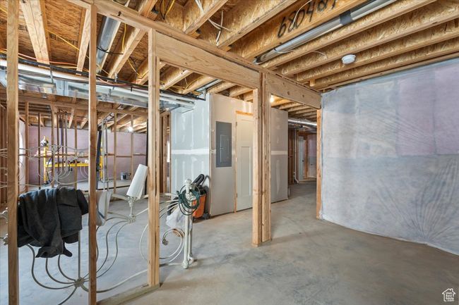 Unfinished basement featuring electric panel | Image 26