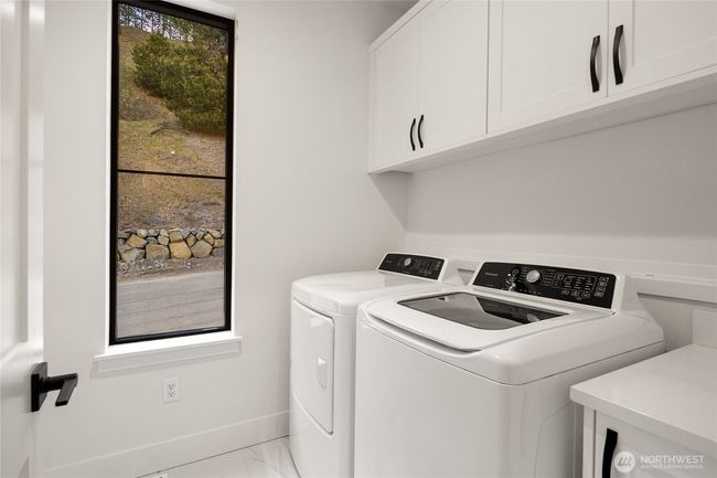As the newest PNW master-planned community, enjoy 200+ acres of open space, trails & the Coal Trax Mt Bike Park. Soaring ceilings in the great roommake each day worthy of celebration & open floorplan appeals to entertaining. Covered deck & patio. Southern-facing homesites range from the mid600s- 900ks. Enjoy a variety of innovative & distinctive new home options with the best all-season recreation just moments away! Built for the future, indulge in a retreat just 90-min to Seattle. Plans and elevations are artist’s renderings only, may not accurately represent the actual condition of a home asconstructed and may also contain options and upgrades which are not included in the sale. Trailside Homes reserves the right to make changes to the floorplan, specifications, dimensions, design and elevations without prior notice. Stated dimensions and square footage are estimated and should not be usedas representations of the home’s actual size. | Image 17