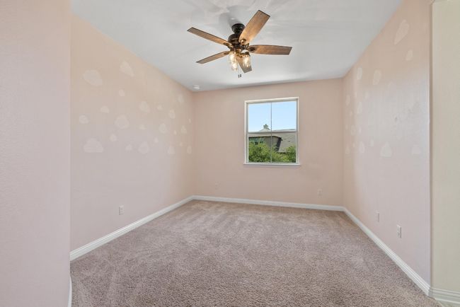 Empty room featuring light carpet and a ceiling fan | Image 31